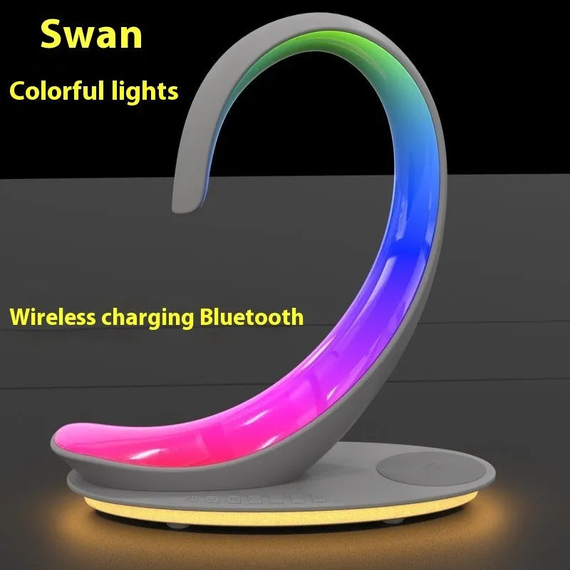 White swan decorative lamp with wireless charging pad and Bluetooth speaker featuring colourful LED lights