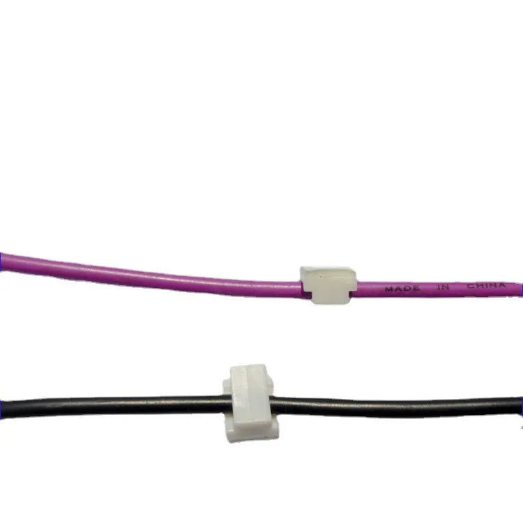 Black PA66 nylon automotive cable management clip with retaining ring, 9mm by 12mm.