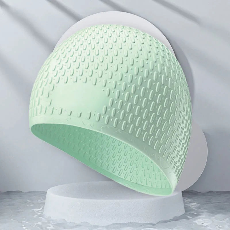 Solid colour silicone swimming cap for adults in one of nine available colours.