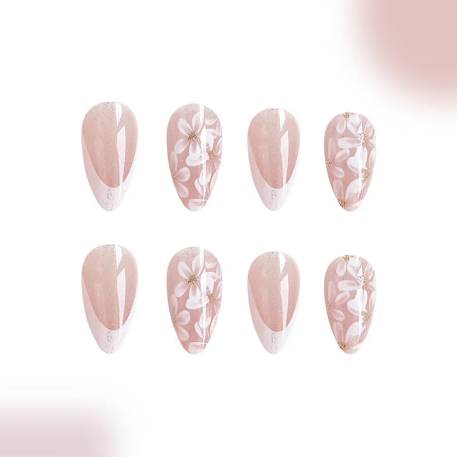 Short glossy almond false nails with French style and glitter powder flower design