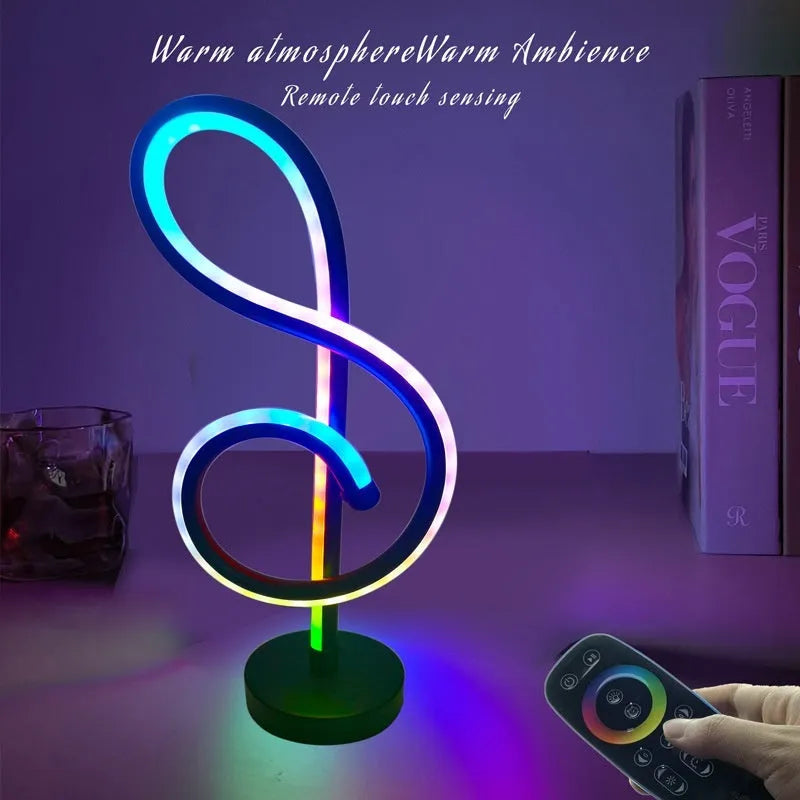 Black musical note-shaped Bluetooth LED light with app remote control on a bedside table.