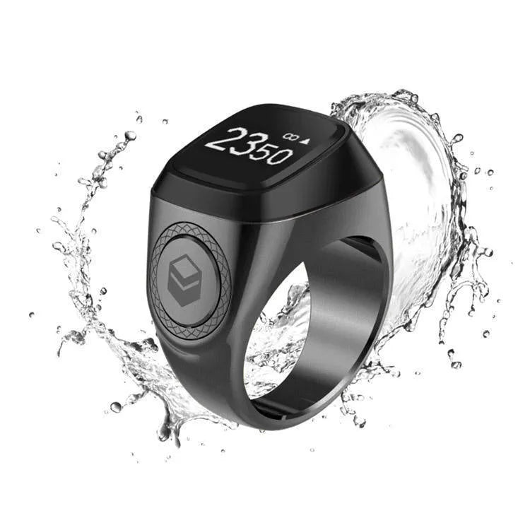 Zikr1 metal smart ring with OLED display showing prayer count, worn on a finger.