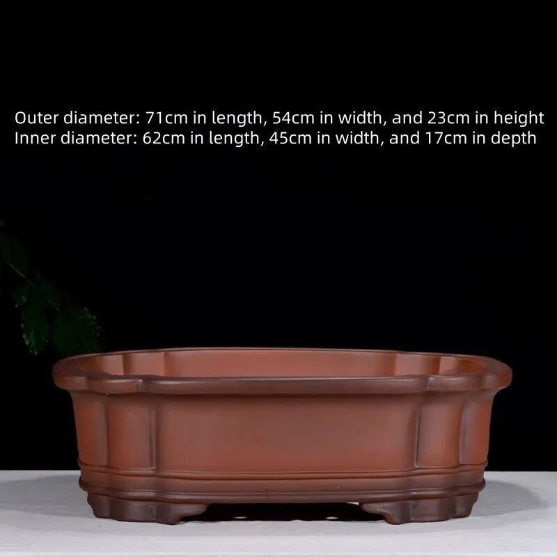 Large antique-finish purple clay flowerpot with raised tree stump and floral design.