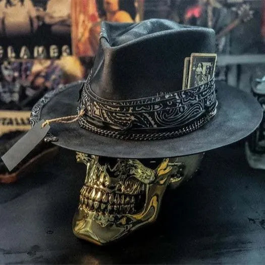 Handmade wool Halloween skull hat with a conical crown on a denim hat base.
