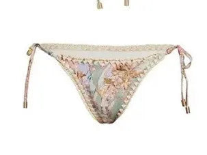 Women's creamy white floral print bikini set with top, briefs, and detachable skirt