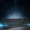 AOC GK410 full-size mechanical keyboard with metal chassis and backlit keys on a desk