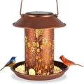 Solar-powered hummingbird pattern bird feeder with integrated garden lighting in iron art construction