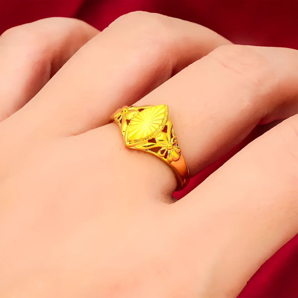 Gold electroplated open flower ring with geometric texture on adjustable brass band