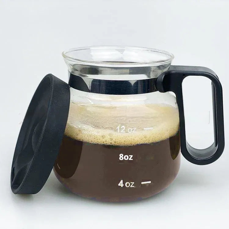 Transparent borosilicate glass coffee maker with a black silicone cover on its neck.