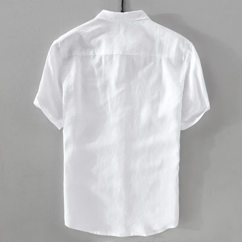 Man wearing a light apricot coloured loose fit short sleeve linen shirt for casual leisurewear.