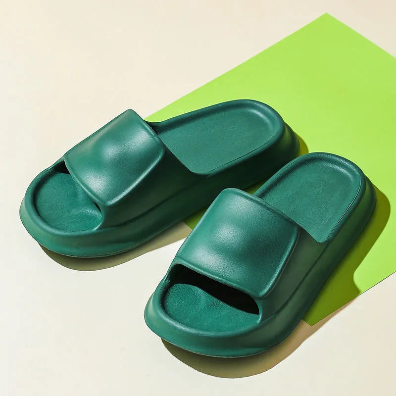A pair of thick-soled, soft EVA flip-flop slippers with a non-slip tread pattern.