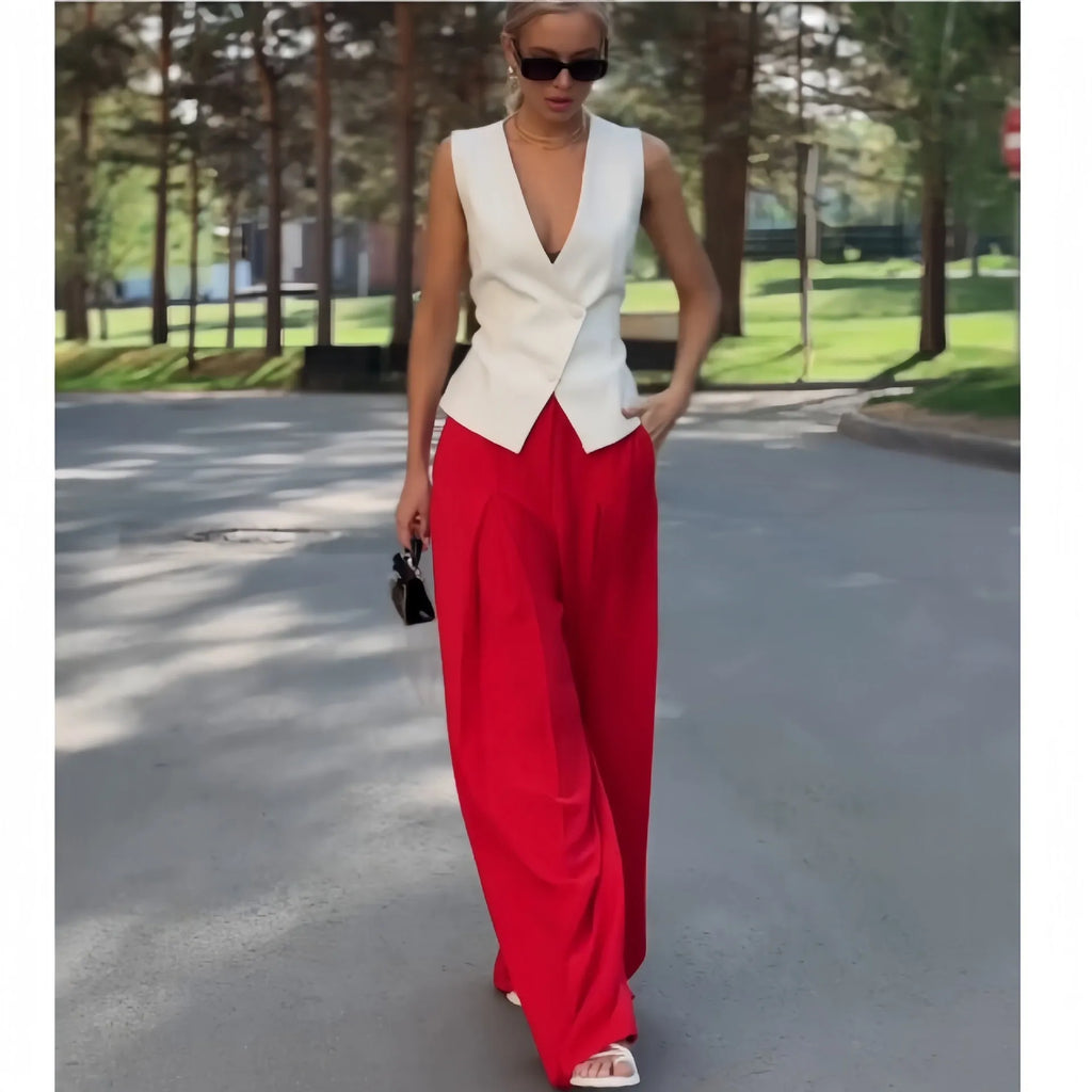 Women's beige two-piece set with deep V-neck sleeveless top and wide leg trousers