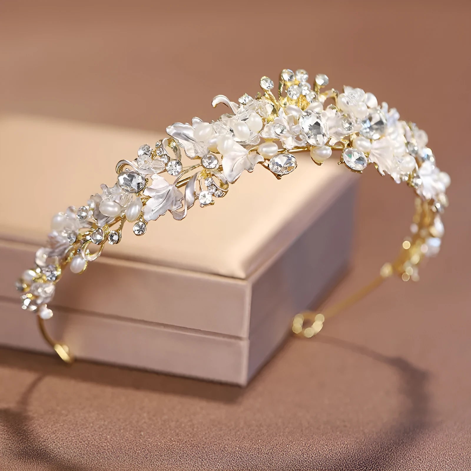 Women's pearl-decorated alloy crown headdress in gold or silver electroplated finish.