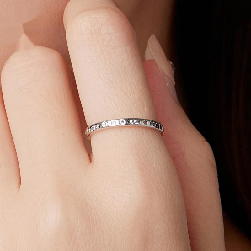 Silver Moss Password I Love You ring with oxidised black finish on a simple band.