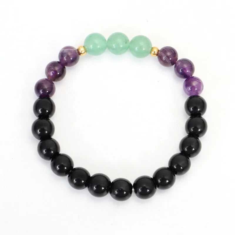 Handmade yoga necklace with lotus pendant and stone beads alongside matching bracelet