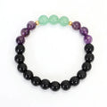 Handmade yoga necklace with lotus pendant and stone beads alongside matching bracelet
