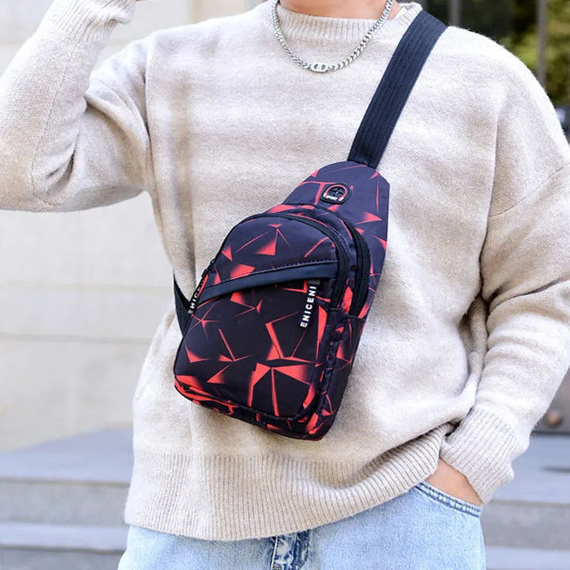 Black print sling chest crossbody bag with earphone hole and zipper pocket.