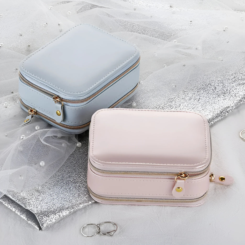 Light blue PU leather zipper jewellery box on a flat surface, compact 11.5x8.5x5cm size