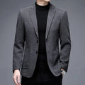 Men's solid colour loose fit woolen winter jacket in grey, shown on a model.