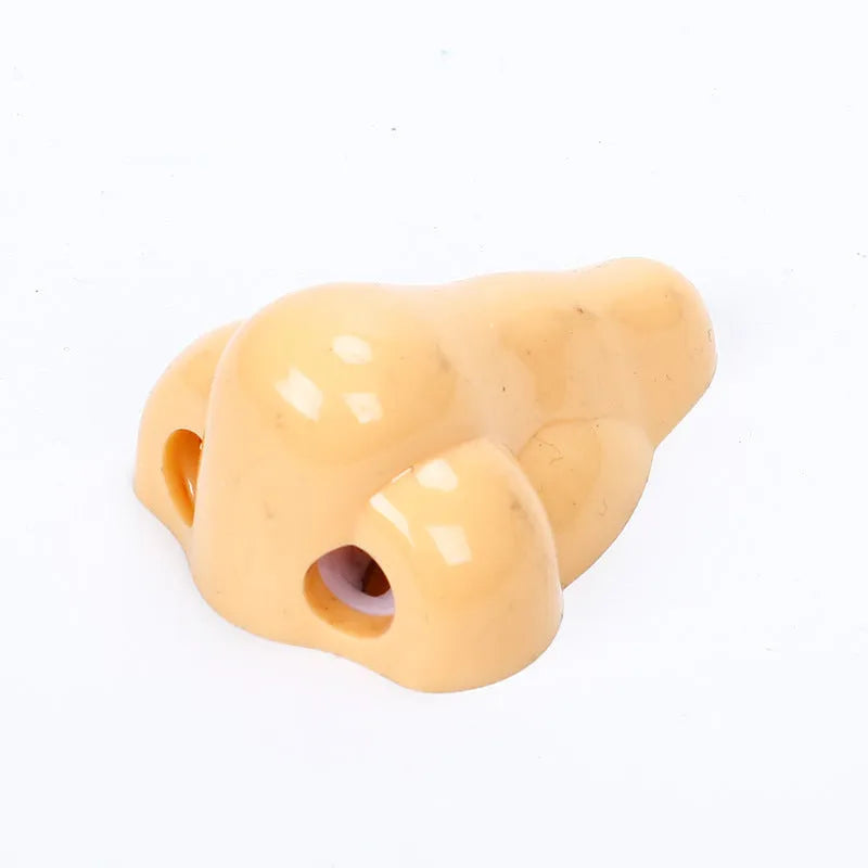Flesh colour plastic manual pencil sharpener with geometry shape measuring 58x45x30mm for student stationery