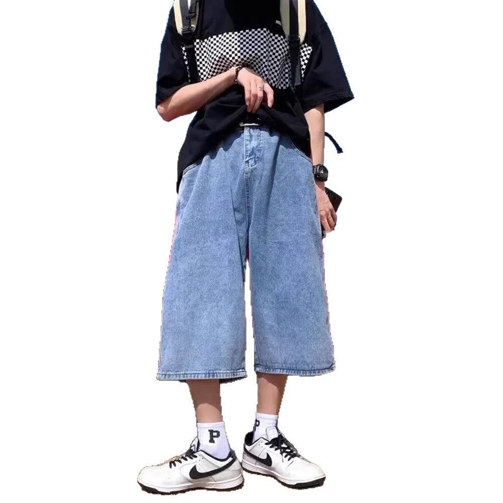 Men's washed light blue denim cropped shorts with a high waist and zipper fly.
