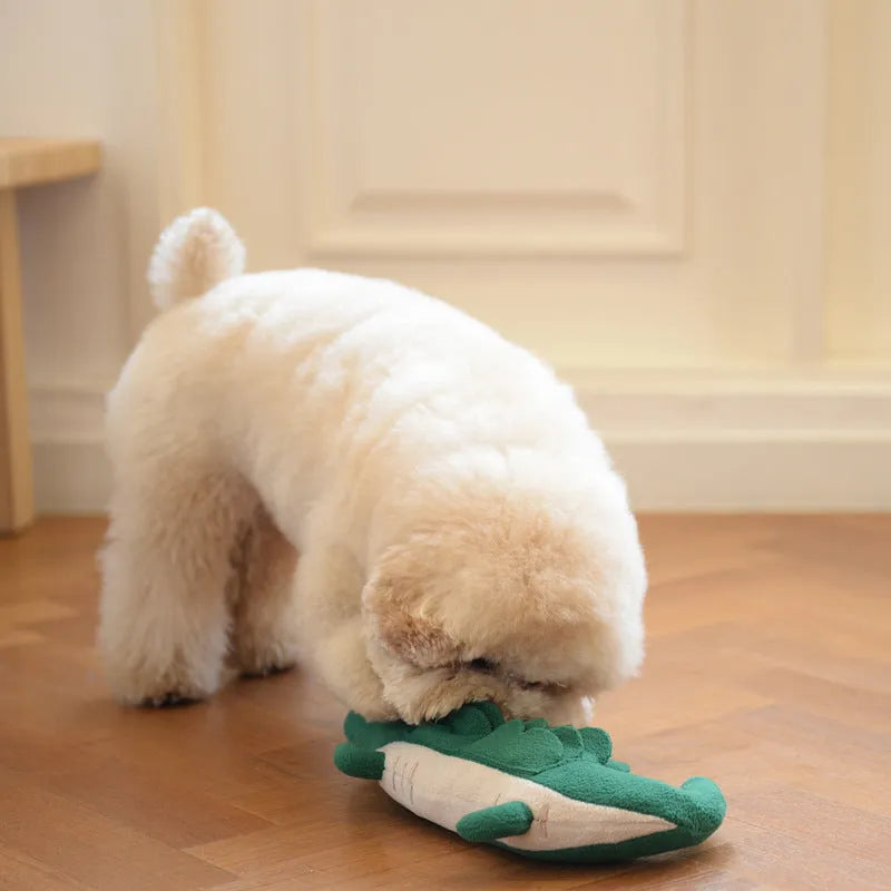 Green plush dog toy with squeaker measuring 35cm long on white background