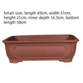 Large rectangular purple clay flowerpot with thickened walls showing traditional handmade texture