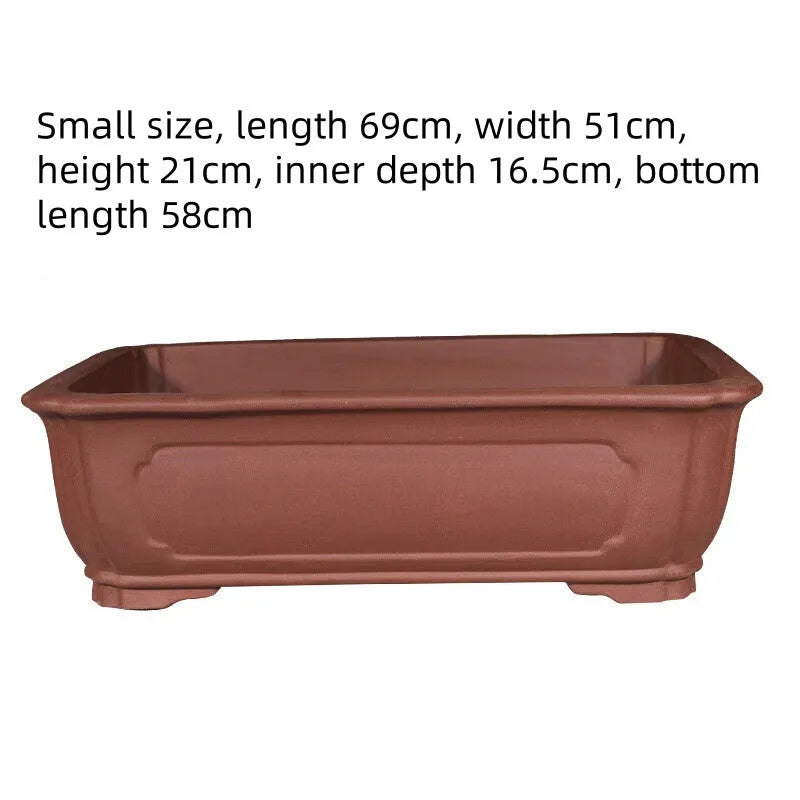 Large rectangular purple clay flowerpot with thickened walls showing traditional handmade texture