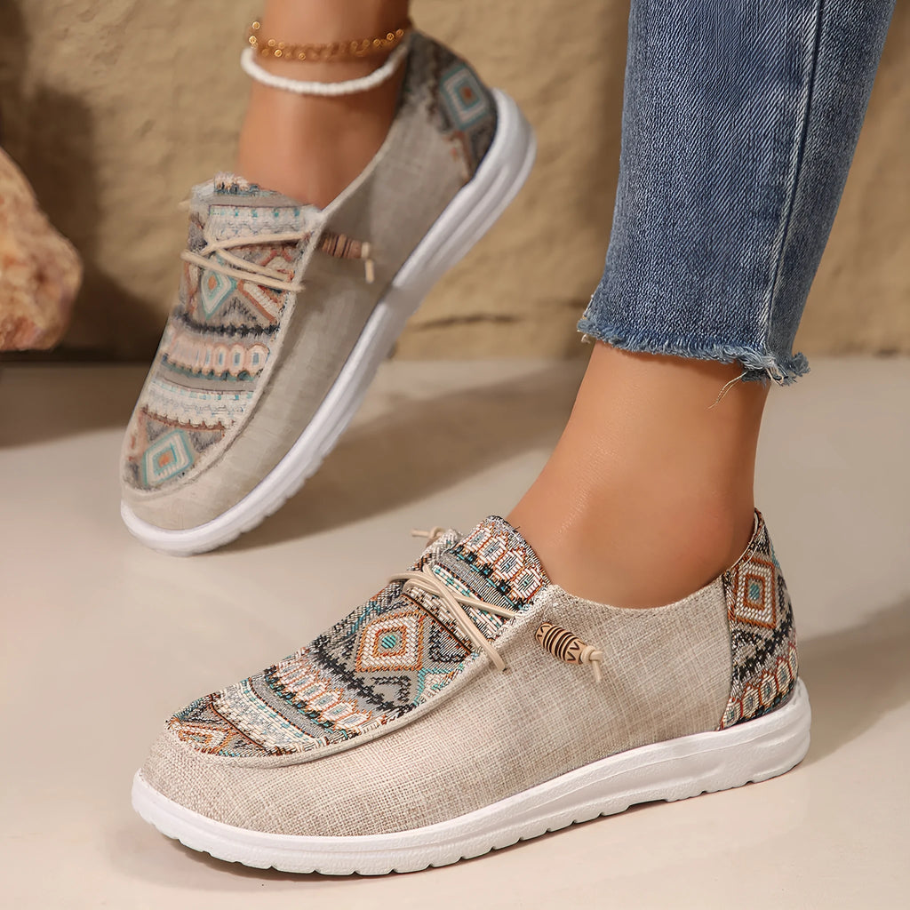 Women's low-top slip-on flat shoes with a round toe in artificial PU, shown in khaki colour on a white background.