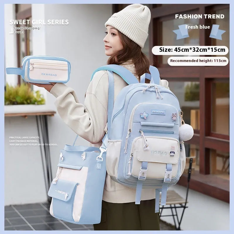 Pink waterproof school backpack for girls with curved shoulder straps, shown with matching pencil case.