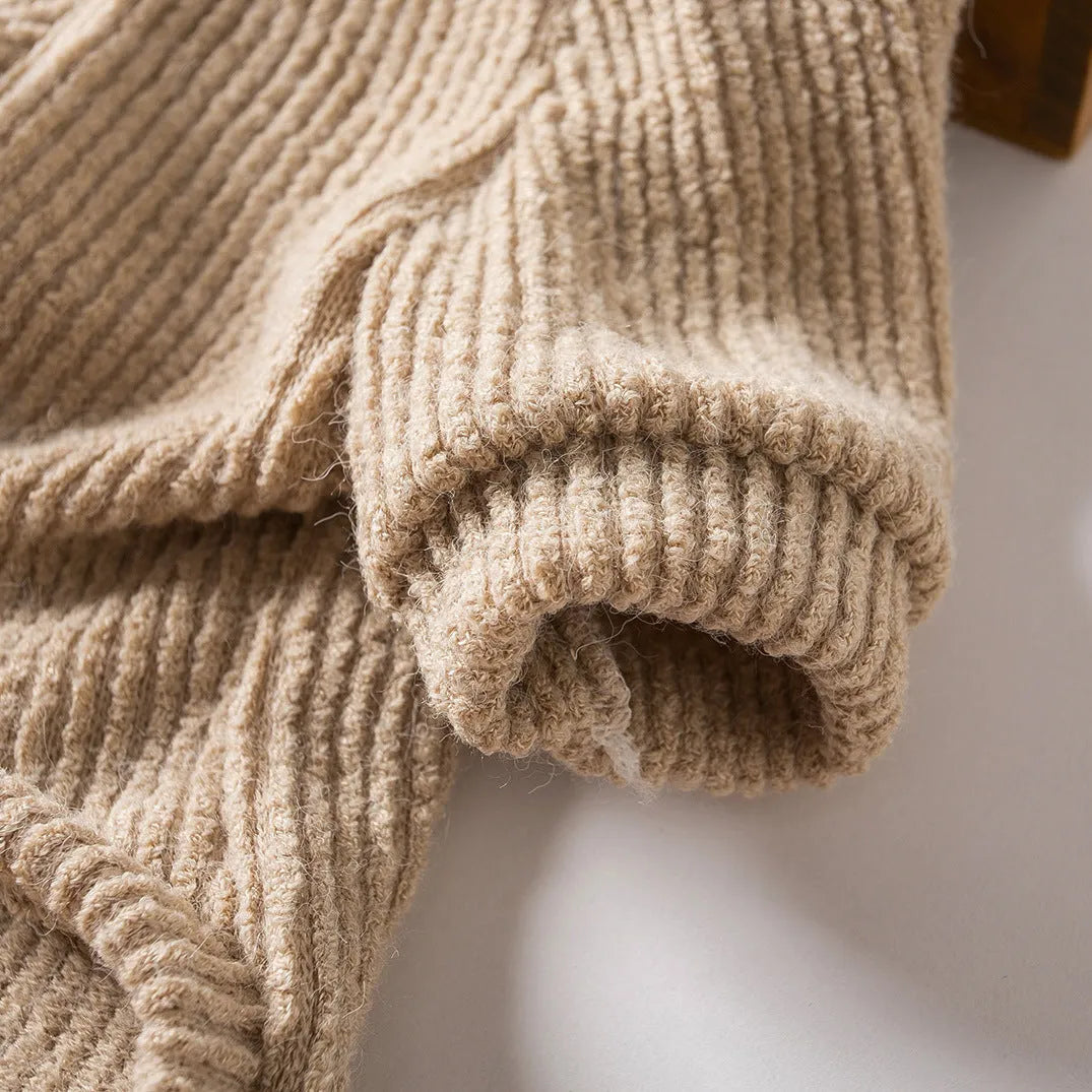 Brown cloth pullover sweater for small breed dogs on a Bichon Frise
