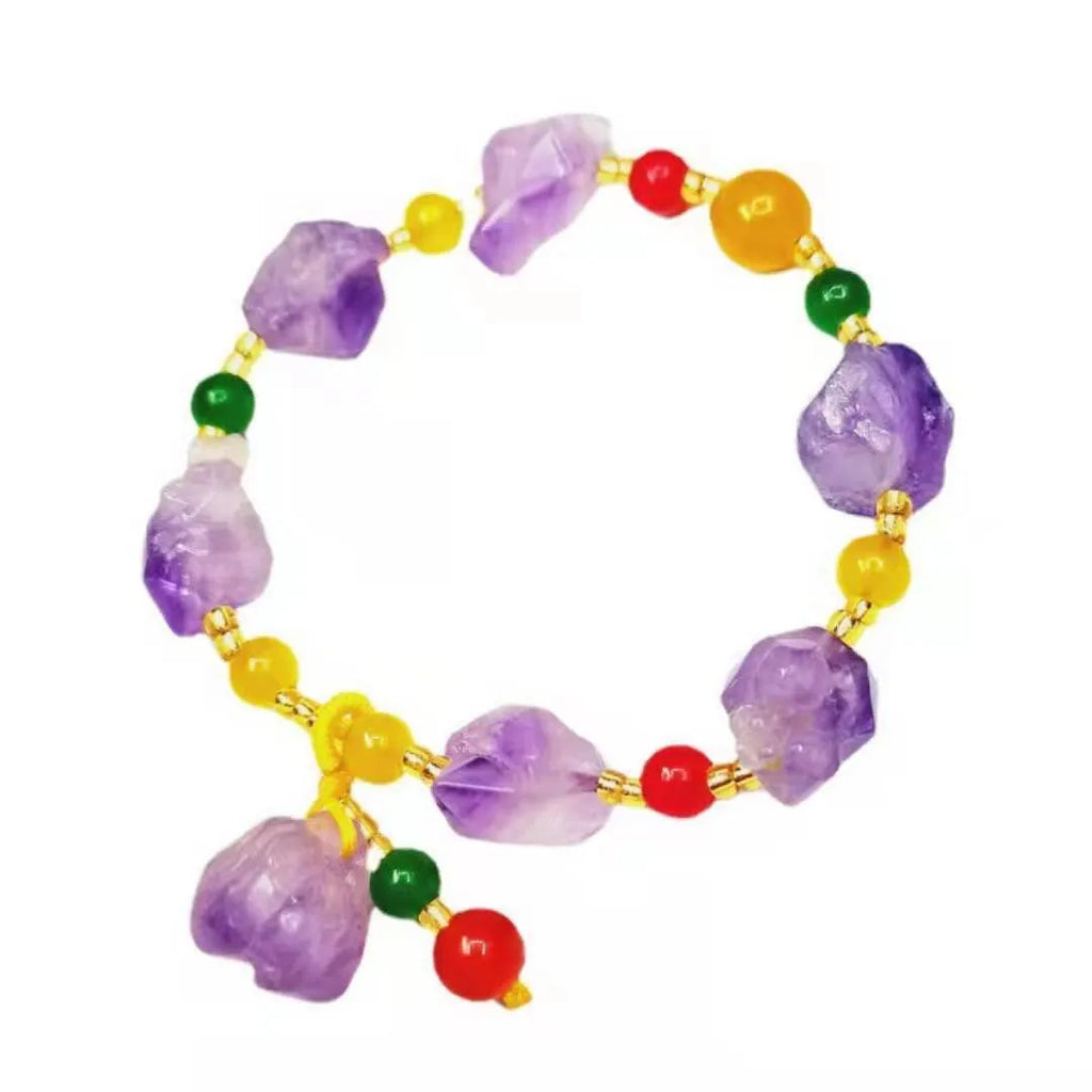 Natural amethyst bracelet with fu charm on woman's wrist