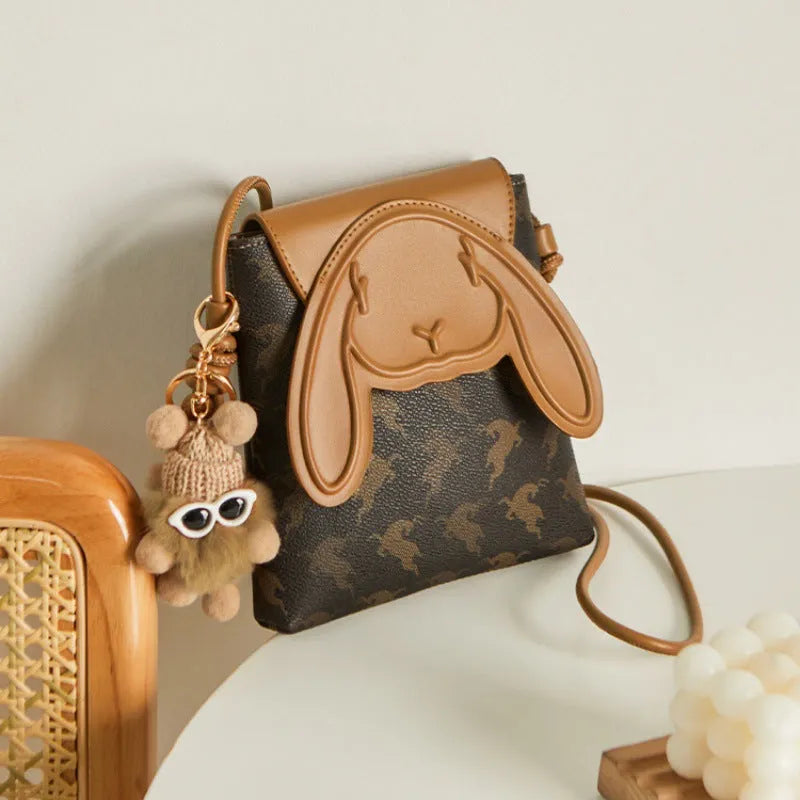 coffee colour crossbody phone bag with pom-pom pendant PU material vertical square shape open pockets