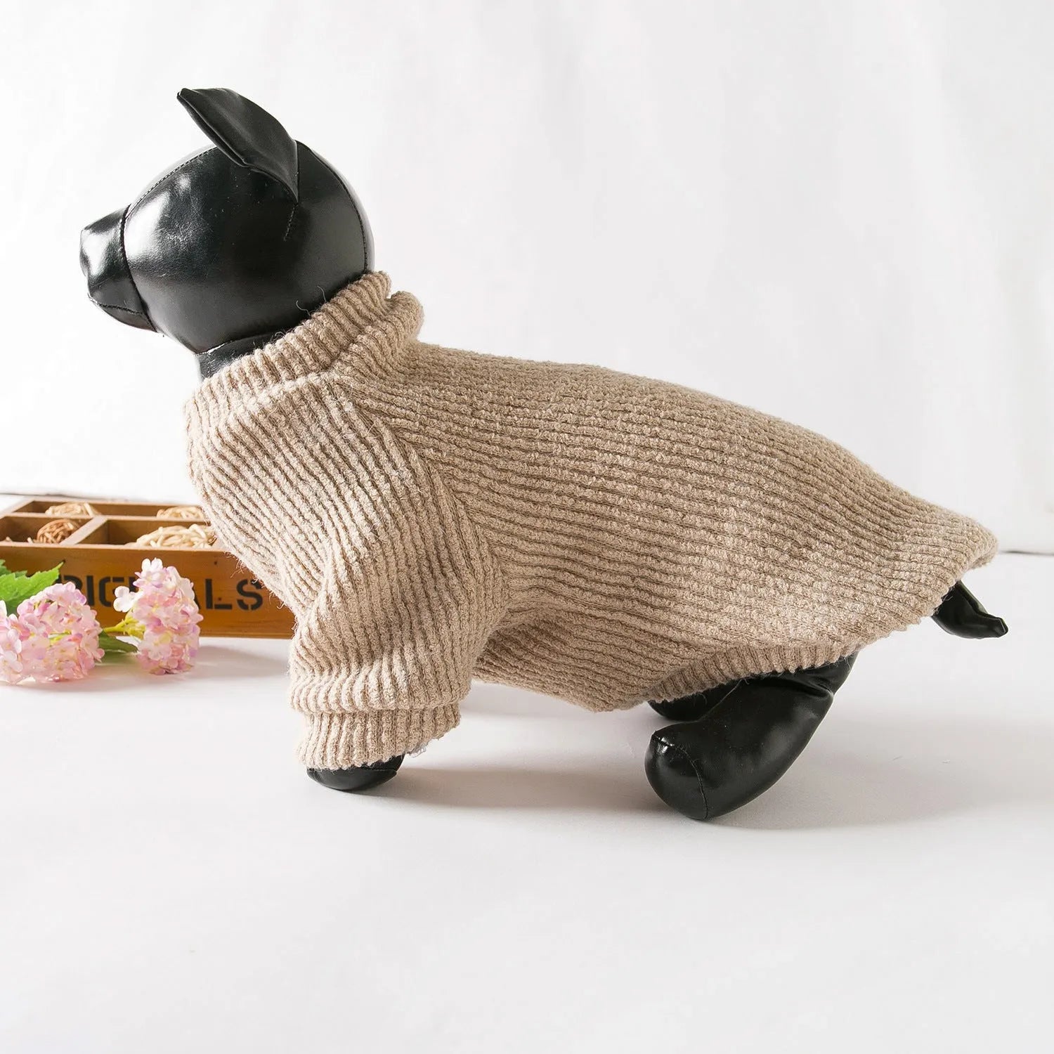 Brown cloth pullover sweater for small breed dogs on a Bichon Frise