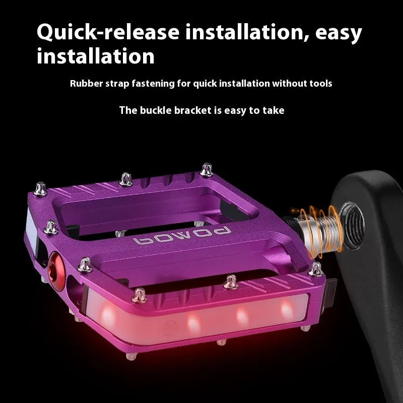 Aluminium alloy bicycle pedals with glowing 710 LED lights in purple, black, red, gold, and titanium colour options.