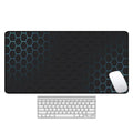 Large geometric pattern desk pad with natural rubber non-slip base on wooden desk