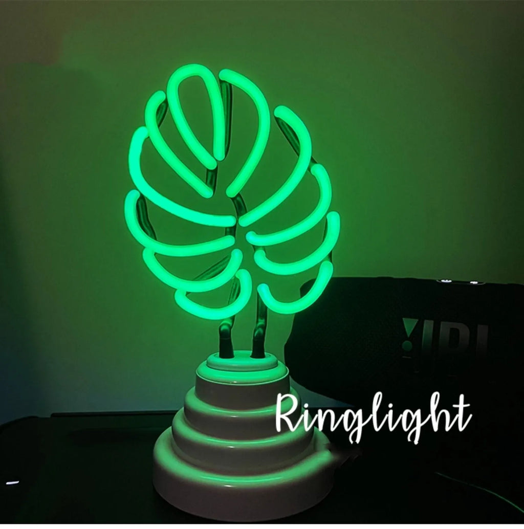 White bamboo-shaped desk lamp with green light, showing large and small size options.