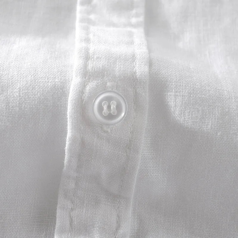 Man wearing a light apricot coloured loose fit short sleeve linen shirt for casual leisurewear.