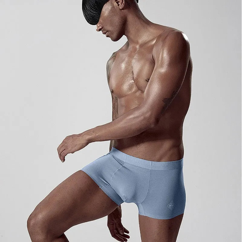 Seamless modal men's underwear in white, pink and green colours with mid waist design