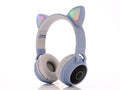 Cartoon style wireless Bluetooth headset with cat ears on headband, shown in multiple colour options.