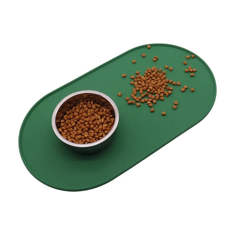 Silicone waterproof placemat for cat food and water bowls in beige colour on a wooden floor.