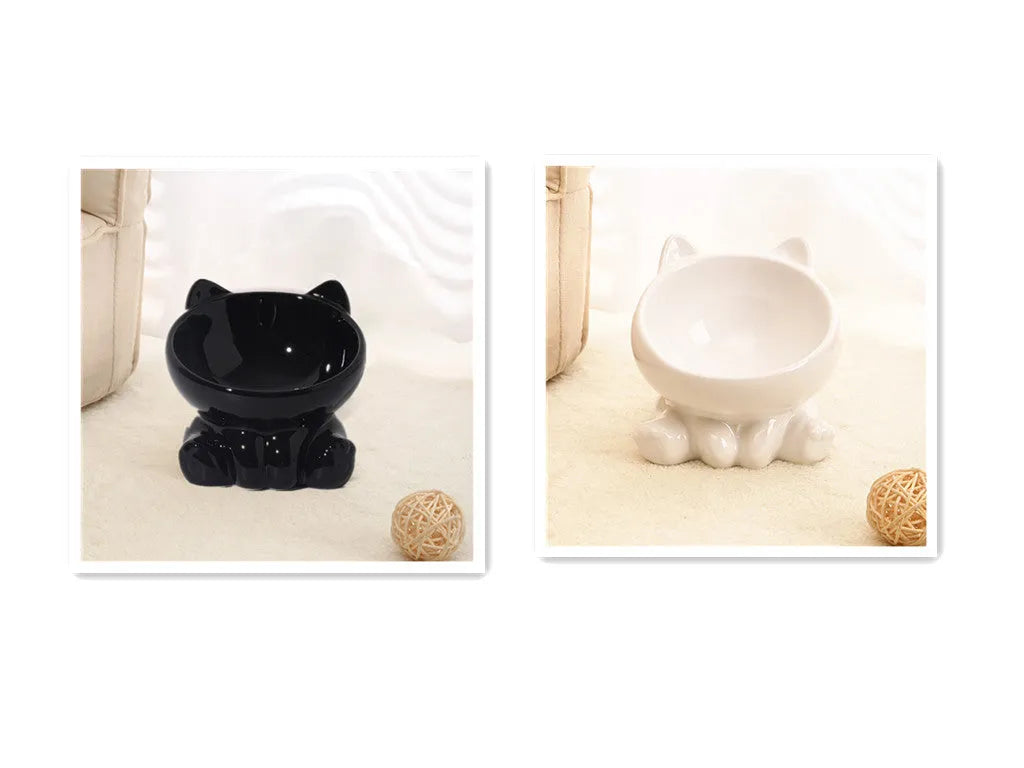 Ceramic cat bowl in black and white with oblique mouth shape on a light background