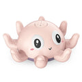 Children's automatic water spray bath toy with flashing lights in blue octopus design on white background