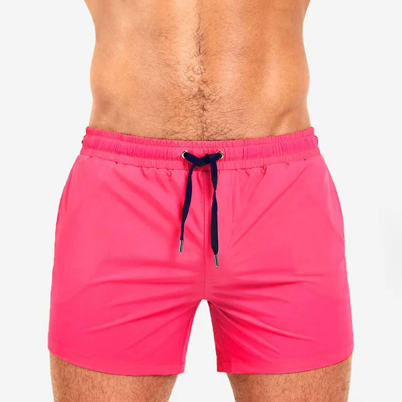 Men's solid colour polyester swimming shorts with mesh lining shown in multiple colours
