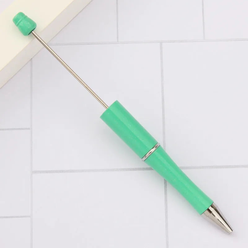 Spinning beaded ballpoint pen showing rotating beads in purple gradient colour