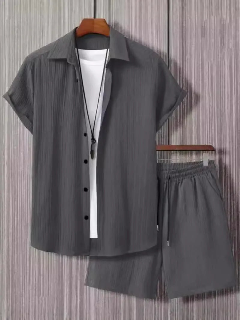 Man wearing a beige jacquard short sleeve suit jacket with matching shorts
