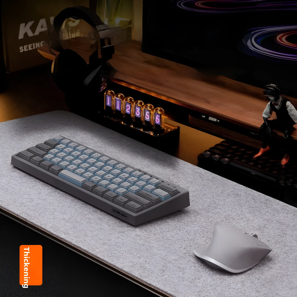 Japanese style simple desk mat in grey felt and cork, shown with keyboard and mouse.