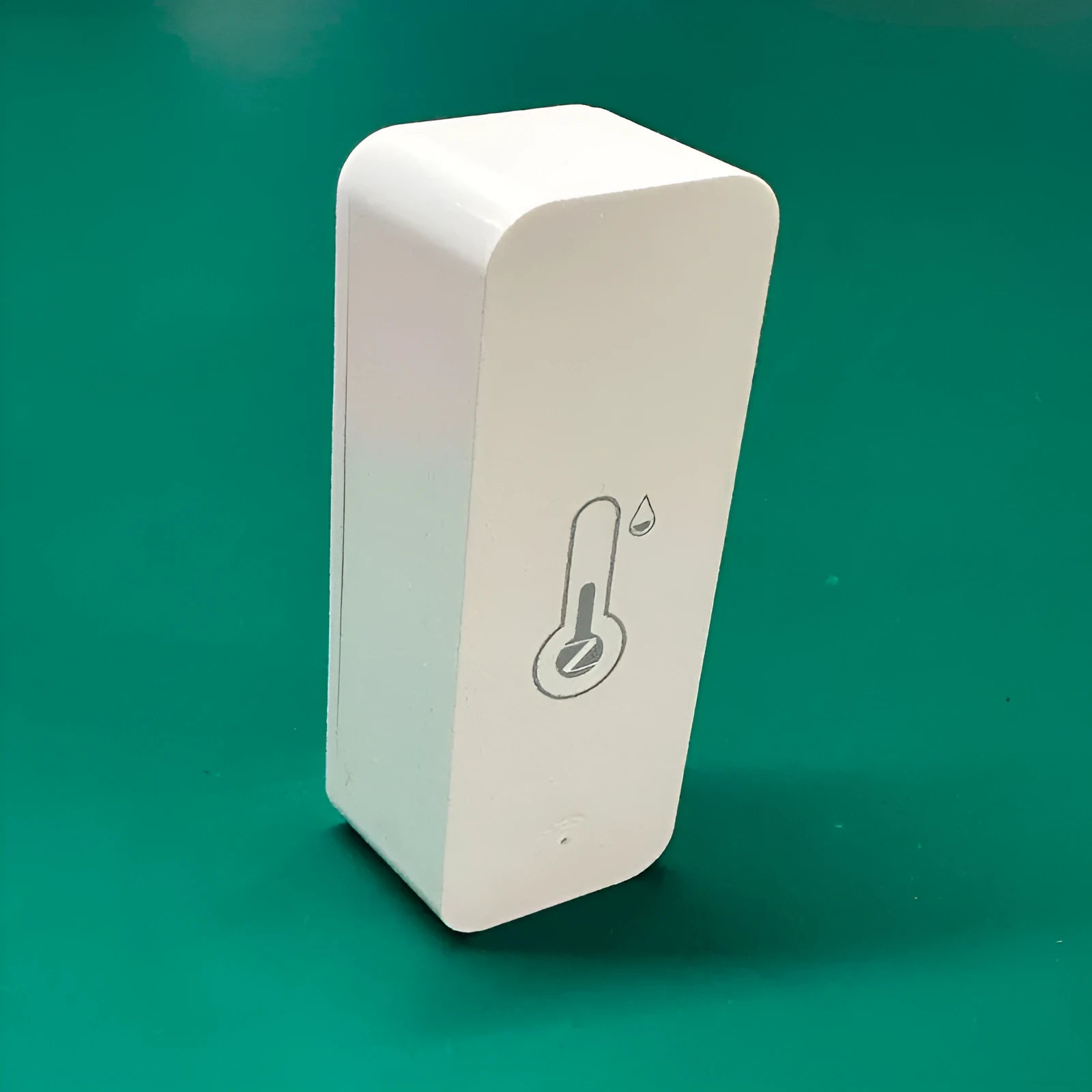 White WiFi temperature and humidity sensor with LCD display showing readings, compact rectangular ABS housing