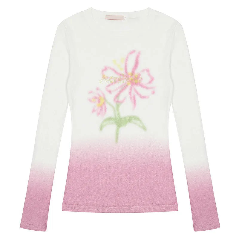 Women's yellow green gradient floral print long sleeve t-shirt on a hanger.