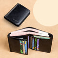 Men's black leather wallet open showing internal card slots, note compartment, and change section.